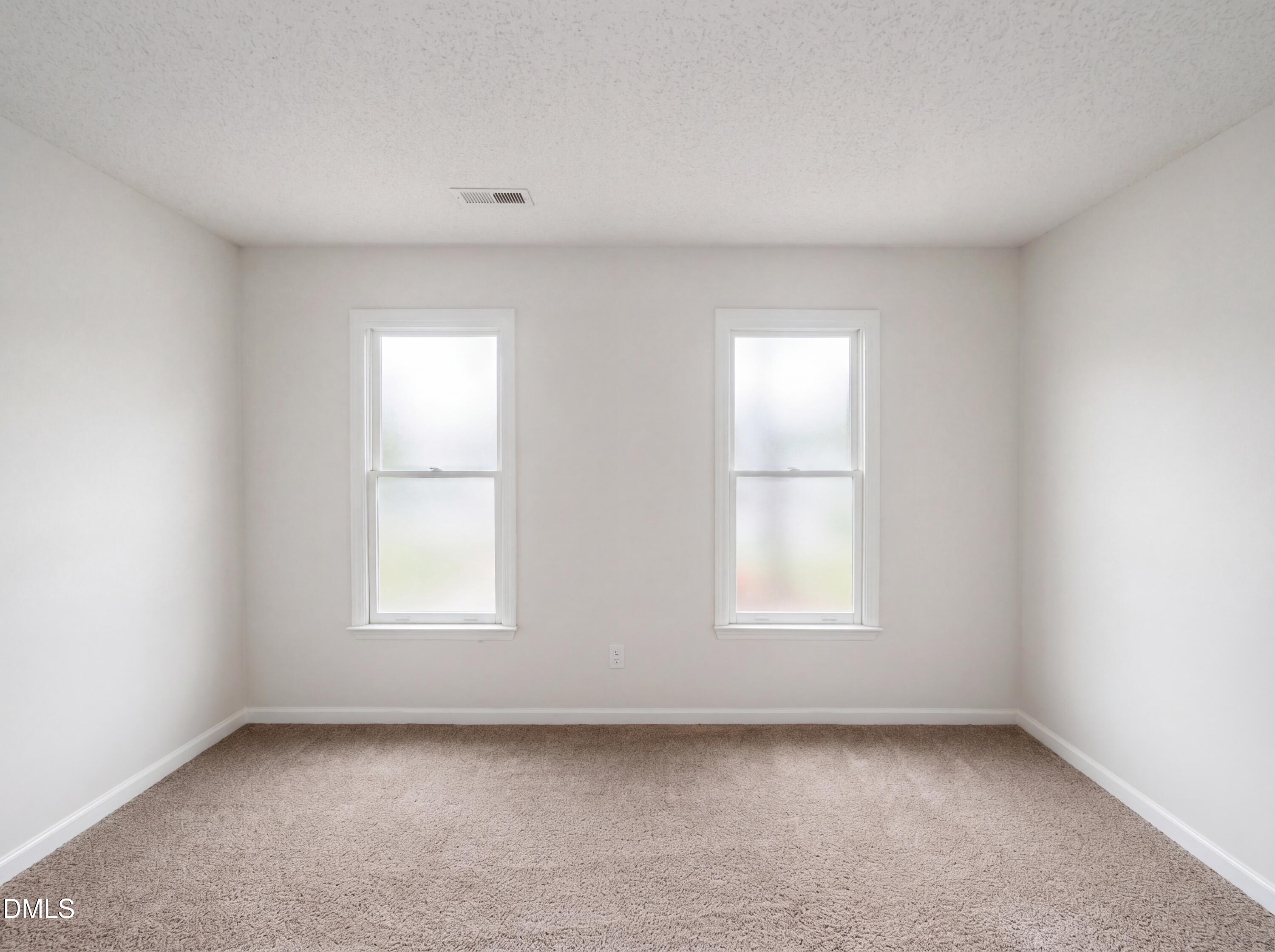 8988 Stamford Club Court Rural Hall, NC 27045 - Photo 13 of 22 an empty room with a window