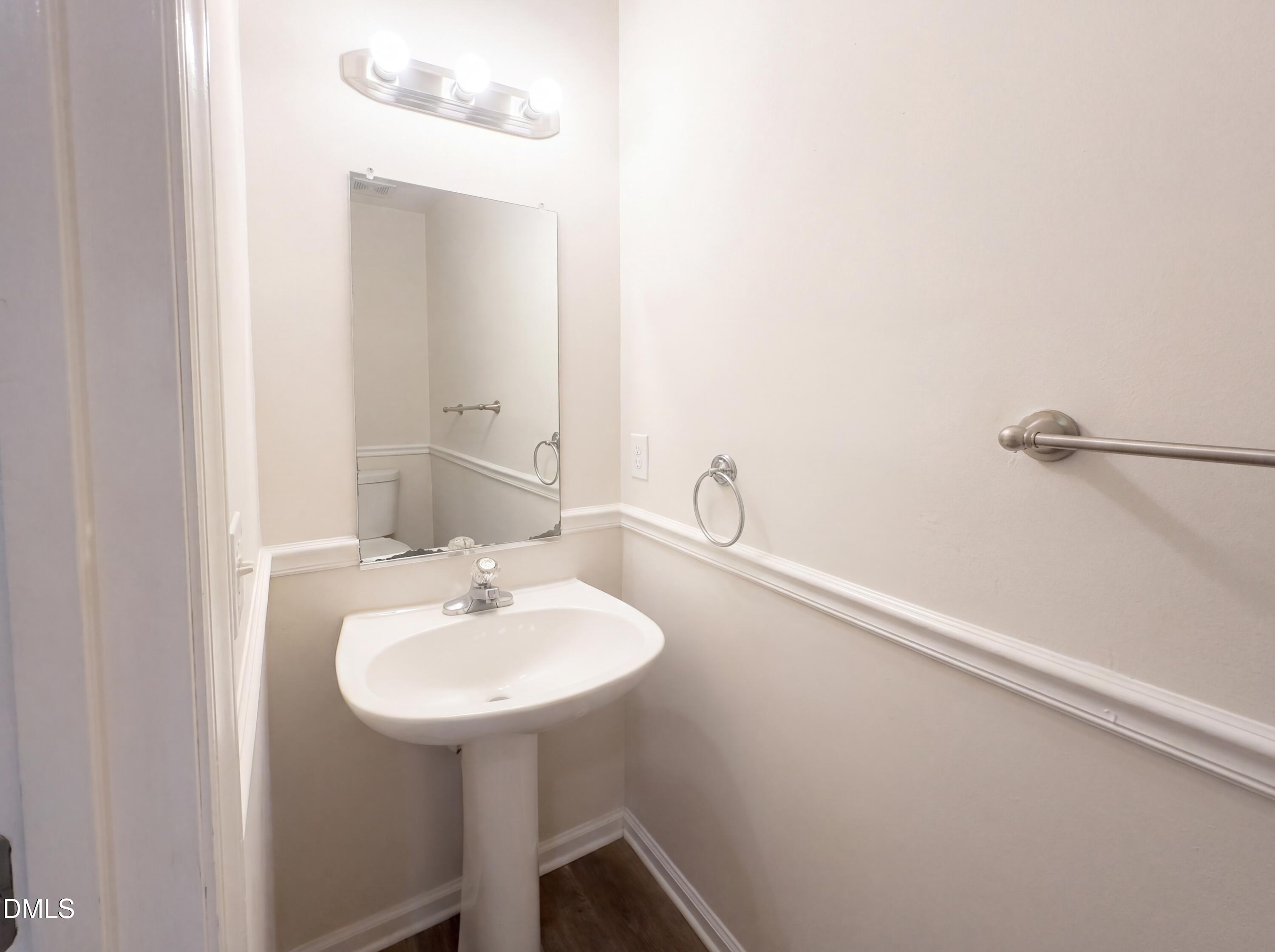 8988 Stamford Club Court Rural Hall, NC 27045 - Photo 16 of 22 a bathroom with a sink and a mirror