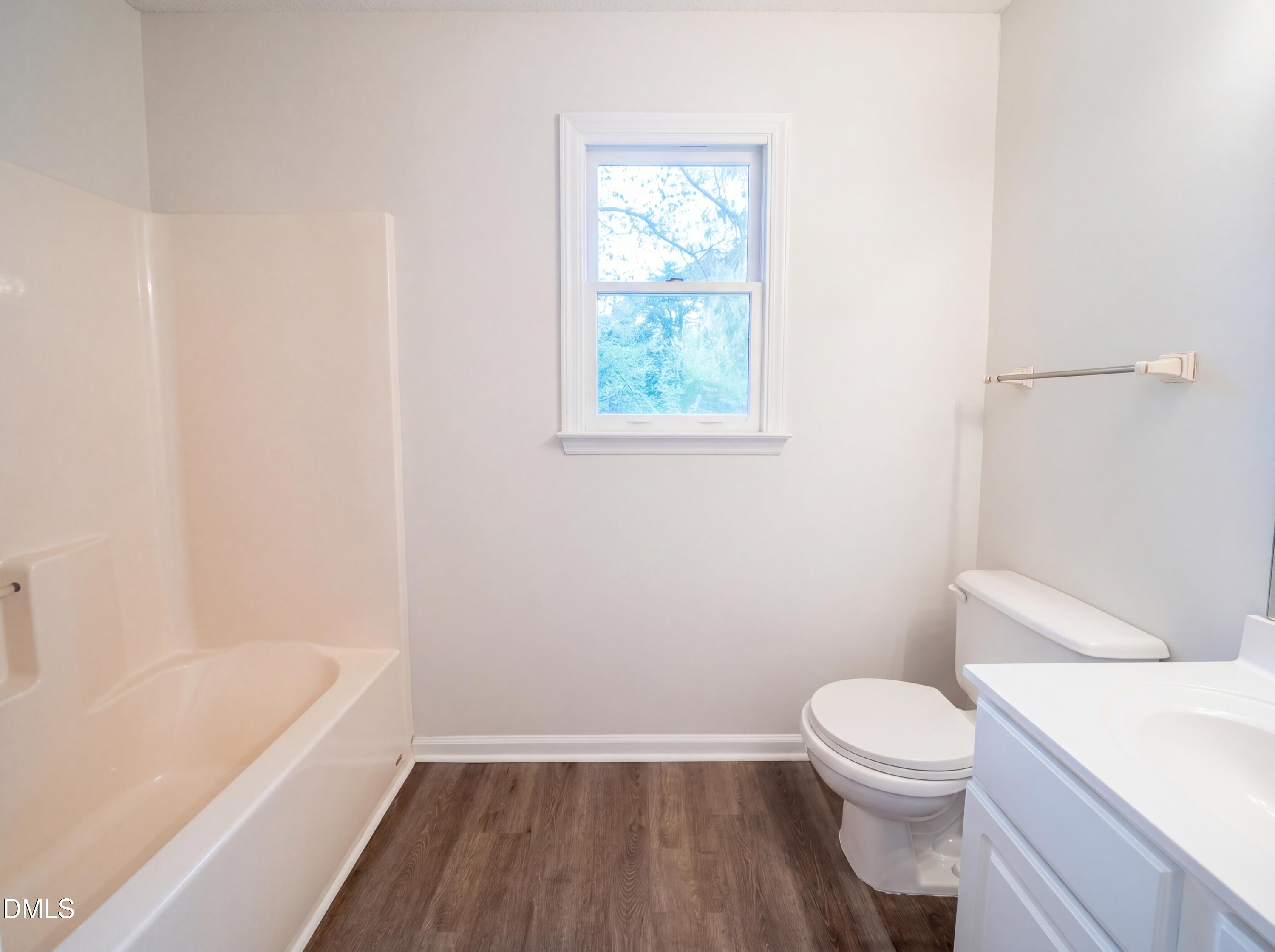 8988 Stamford Club Court Rural Hall, NC 27045 - Photo 18 of 22 a bathroom with a toilet and a bathtub