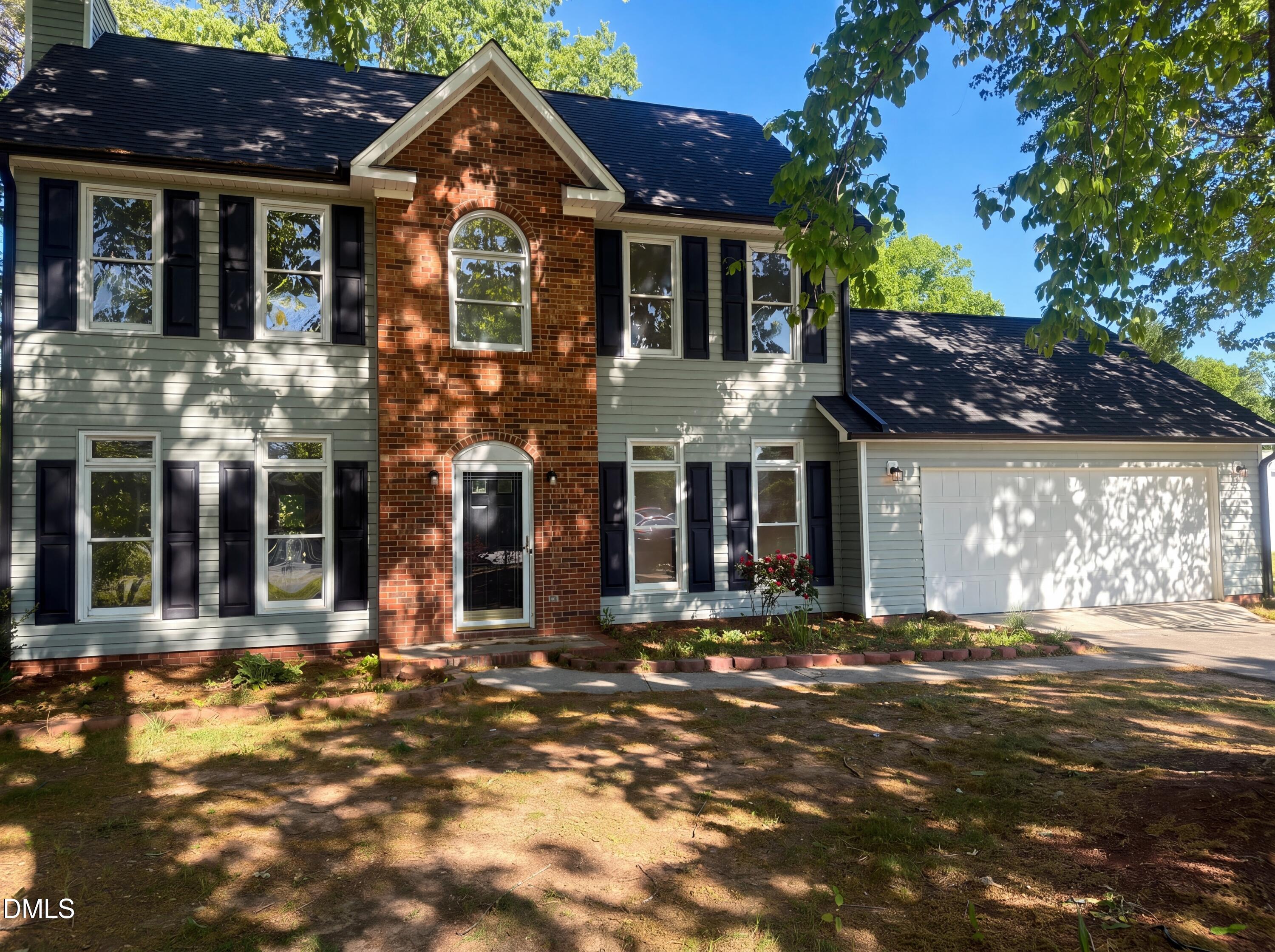 8988 Stamford Club Court Rural Hall, NC 27045 - Photo 3 of 22 a front view of a house with a yard