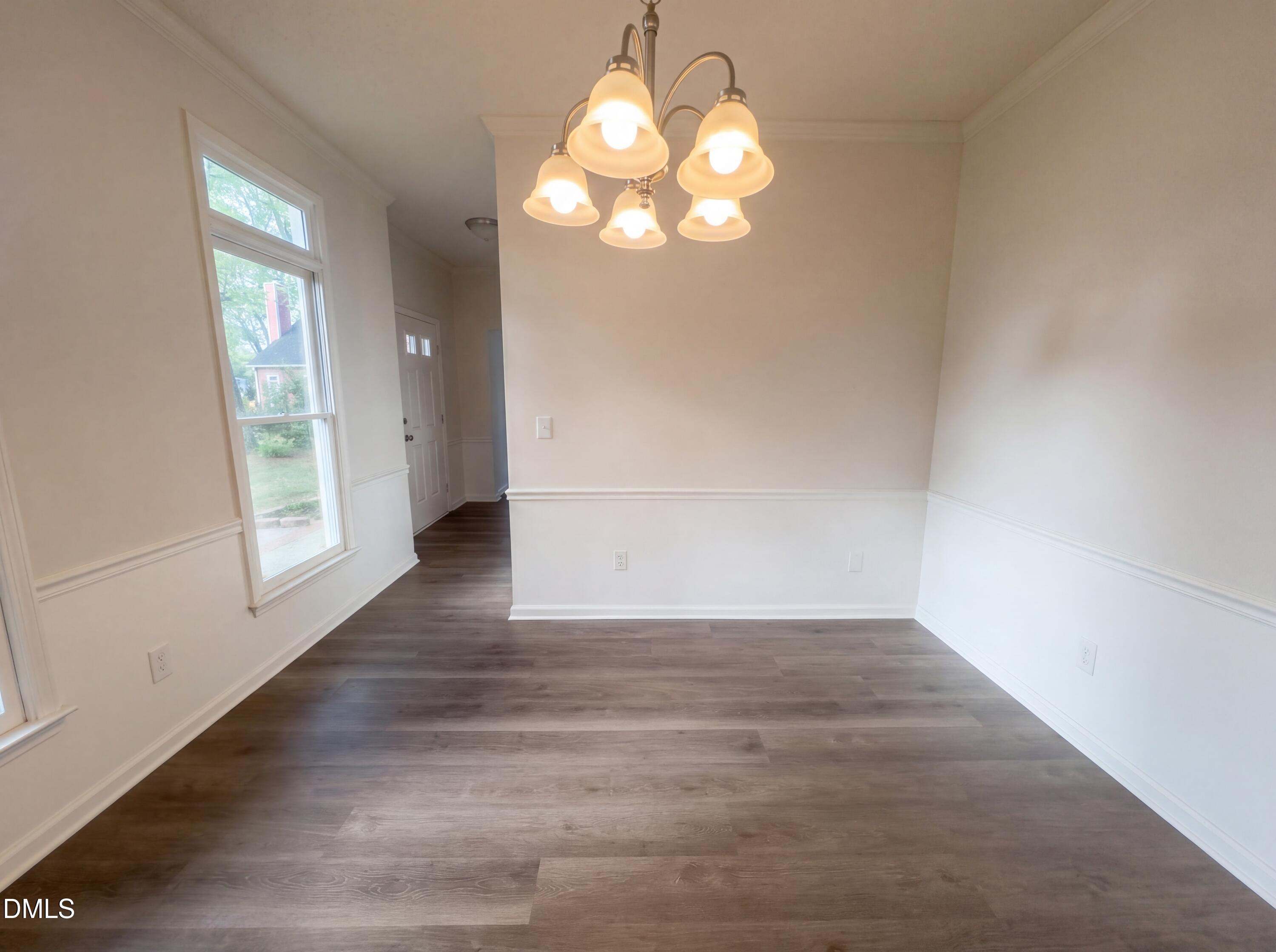 8988 Stamford Club Court Rural Hall, NC 27045 - Photo 8 of 22 an empty room with wooden floor and windows
