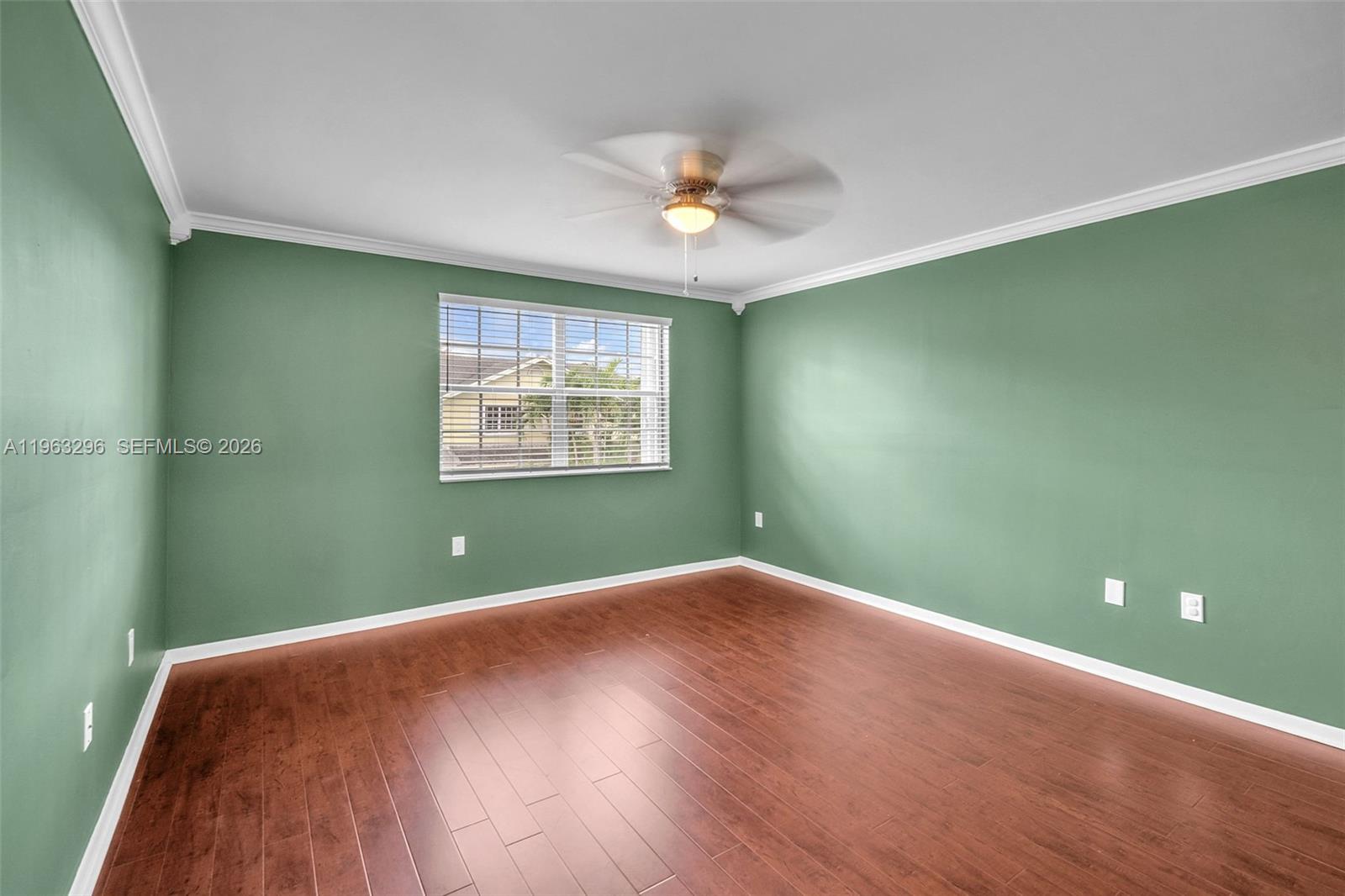 11864 Southwest 97th Terrace Miami, FL 33186 - Photo 17 of 32 a view of a room with a ceiling fan and a window