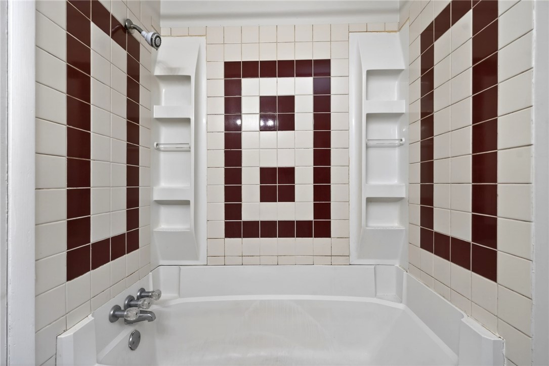 3659 Trail-On Road Dayton, OH 45439 - Photo 25 of 38 This bathroom features a classic tiled shower and bathtub combination for a functional space.
