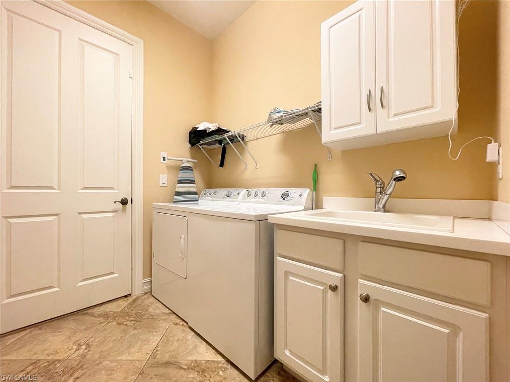 7302 Acorn Way Naples, FL 34119 - Photo 31 of 40 a utility room with sink dryer and washer