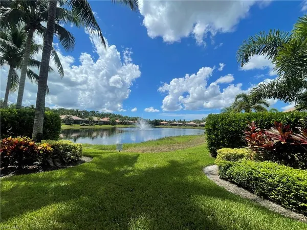 a view of a lake with a building in the background