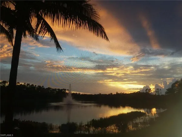 a view of a sign board and a yard