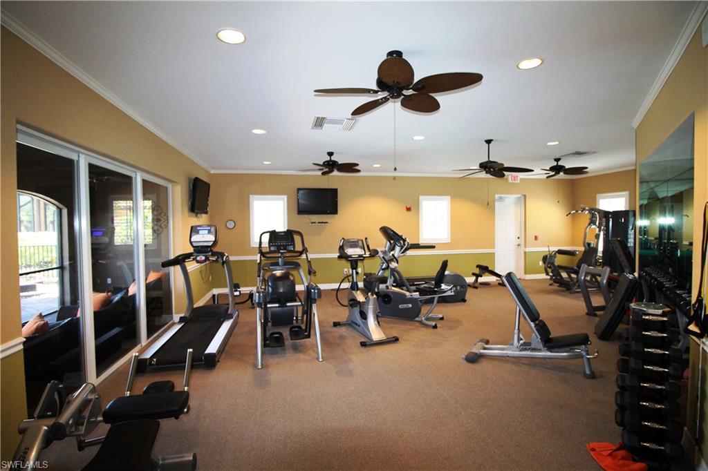 7302 Acorn Way Naples, FL 34119 - Photo 40 of 40 a view of a room with gym equipment