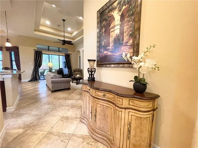 a kitchen with stainless steel appliances kitchen island granite countertop a sink and cabinets