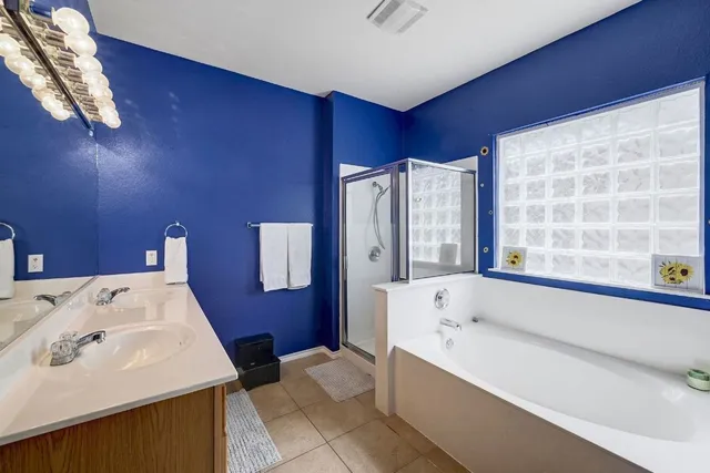 a bathroom with a bathtub and a sink
