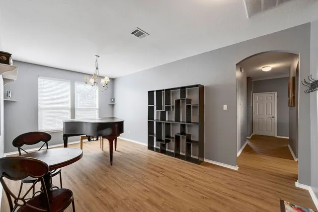 a view of a livingroom with furniture and wooden floor