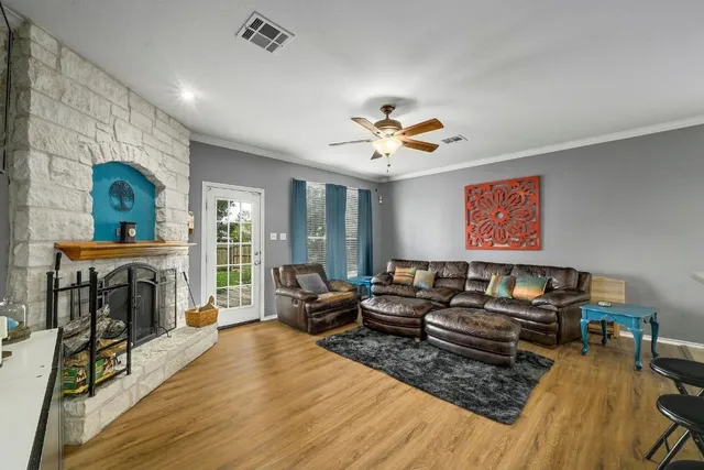 a living room with furniture and a fireplace