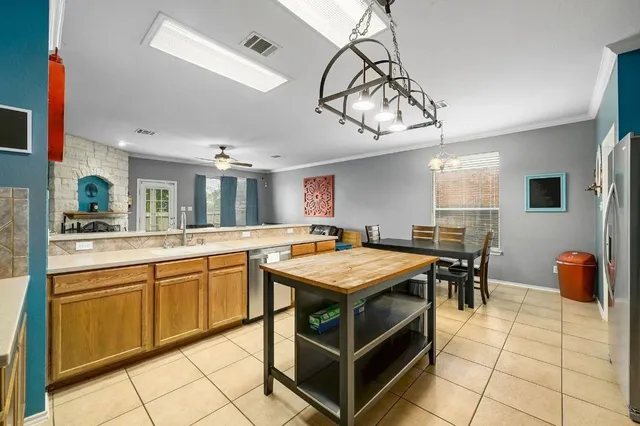 a kitchen with stainless steel appliances granite countertop a sink and cabinets