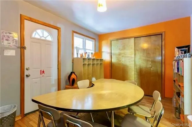a view of a dining room with furniture and window