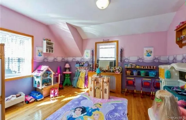 a bed room with furniture and a baby crib