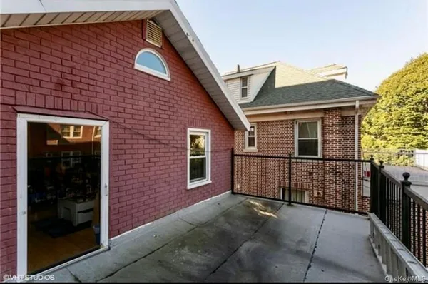 front view of a house with a large window
