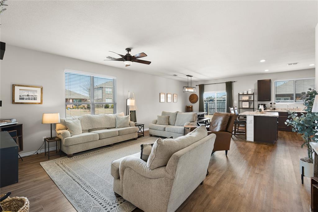1061 Stanridge Lane Van Alstyne, TX 75495 - Photo 12 of 37 a living room with furniture kitchen view and a window