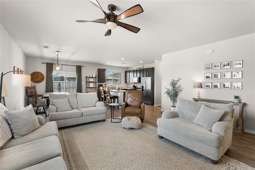 1061 Stanridge Lane Van Alstyne, TX 75495 - Photo 13 of 37 a living room with furniture and a large window