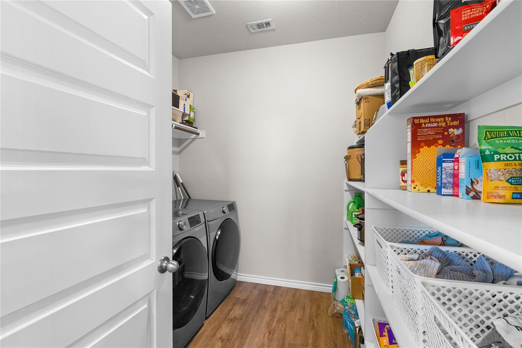 1061 Stanridge Lane Van Alstyne, TX 75495 - Photo 22 of 37 a view of walk in closet with clothes and shoes