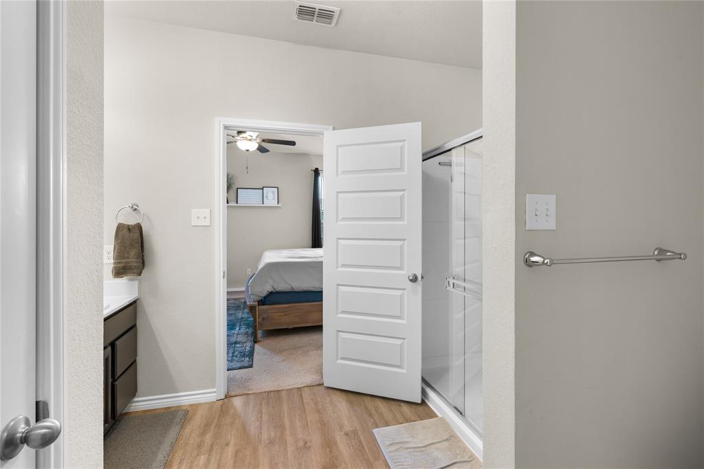 1061 Stanridge Lane Van Alstyne, TX 75495 - Photo 25 of 37 a bedroom with a bed and a view of bedroom