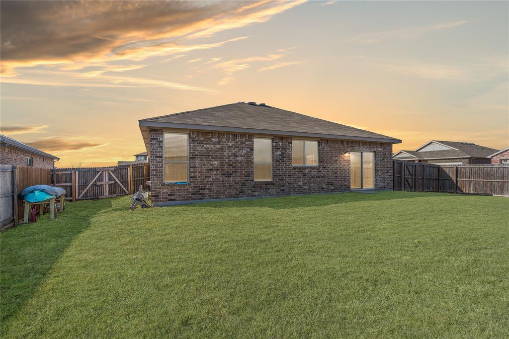 1061 Stanridge Lane Van Alstyne, TX 75495 - Photo 34 of 37 a view of a house with a backyard