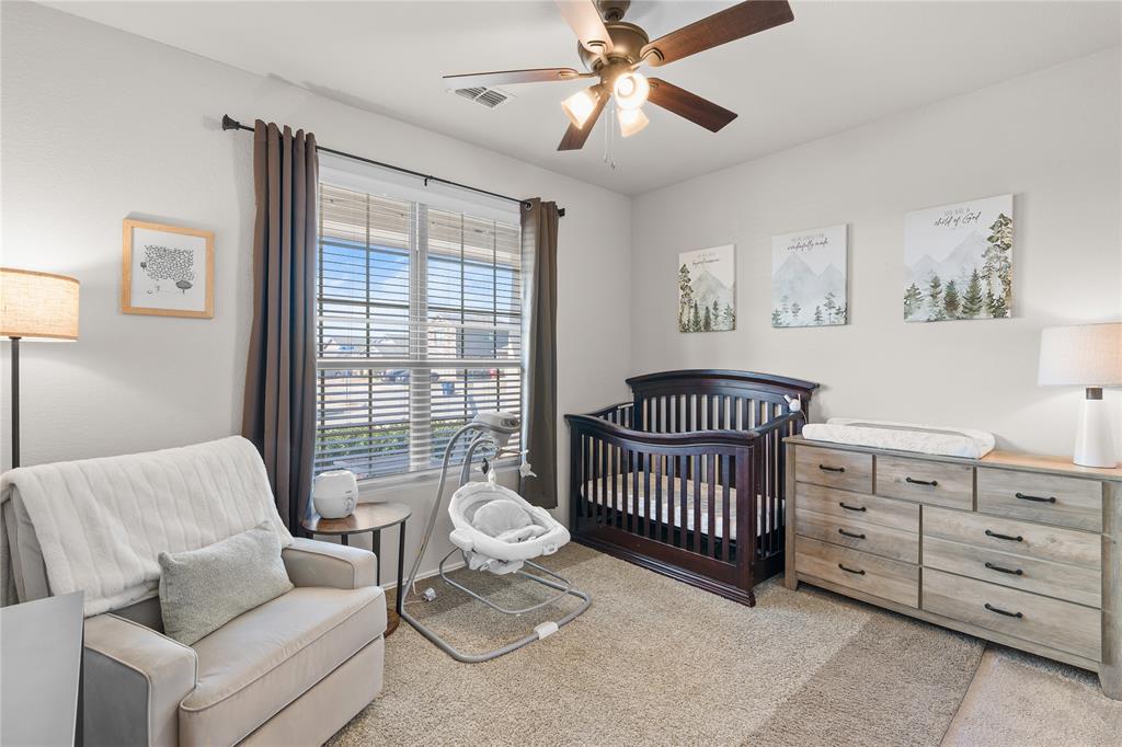 1061 Stanridge Lane Van Alstyne, TX 75495 - Photo 7 of 37 a bedroom with furniture and a window