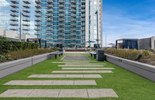 5925 Almeda Road, Unit 12308 Houston, TX 77004 - Photo 36 of 48 a view of swimming pool with outdoor seating and plants