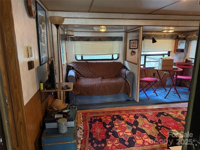 a living room with furniture and a rug