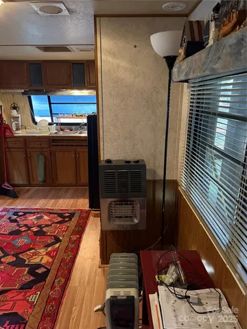 a kitchen with stainless steel appliances a stove a sink dishwasher and cabinets with wooden floor