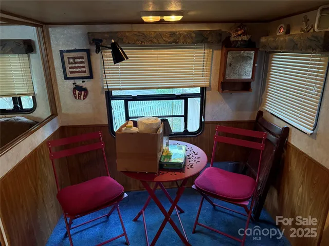 a bedroom with two beds and a window