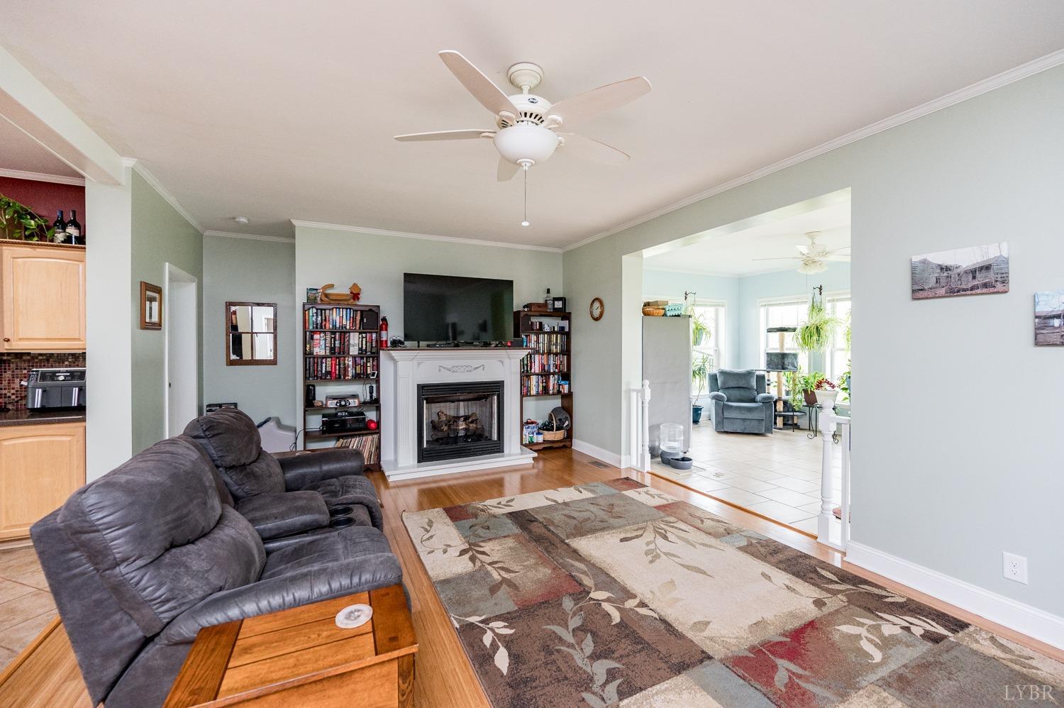 156 Little Falling Road Concord, VA 24538 - Photo 14 of 27 a living room with furniture a fireplace and a flat screen tv