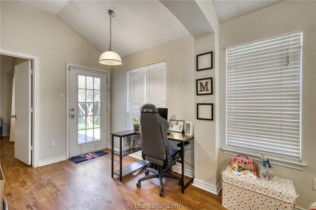 1015 Fallbrook Loop College Station, TX 77845 - Photo 6 of 15 Office space with vaulted ceiling, wood finished floors, and baseboards