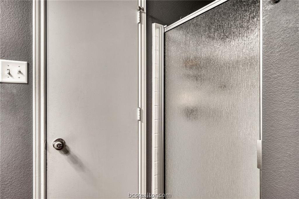 1015 Fallbrook Loop College Station, TX 77845 - Photo 9 of 15 Details featuring a textured wall and an enclosed shower