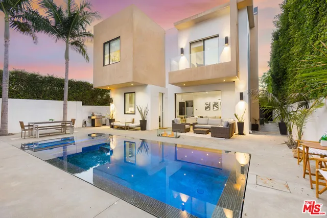 a view of a living room and kitchen