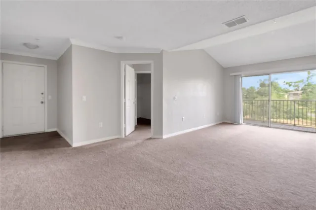 a view of empty room with windows