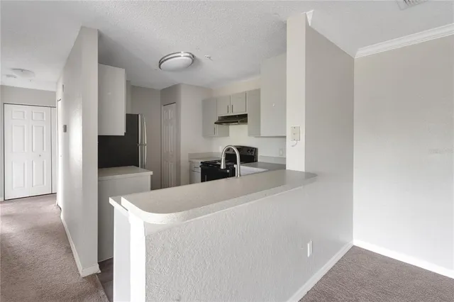 a room with a bed and a television