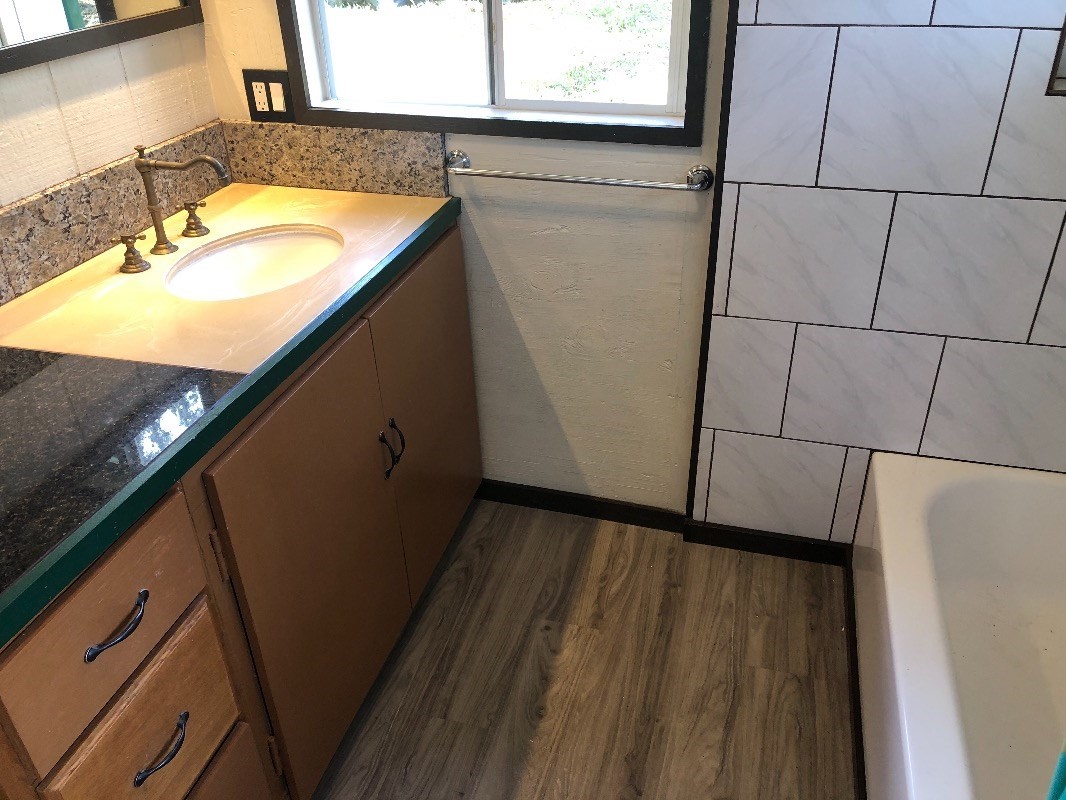 16-1568 38th Avenue Keaau, HI 96749 - Photo 11 of 30 a bathroom with a sink and a mirror