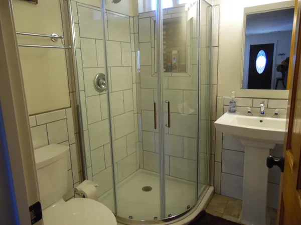a bedroom with a bed and a mirror