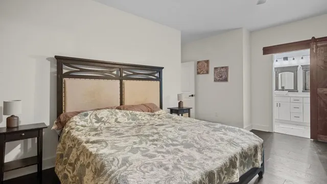 a bedroom with a bed and a mirror