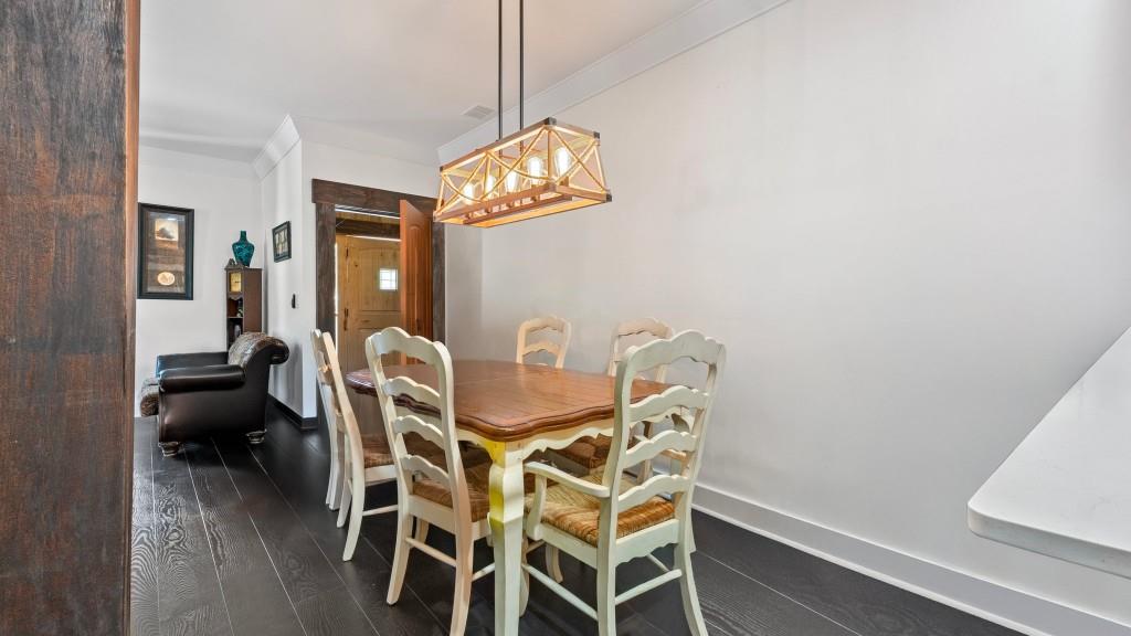 610 Madola Road, Unit 1 Epworth, GA 30541 - Photo 4 of 14 a view of a dining room with furniture and chandelier