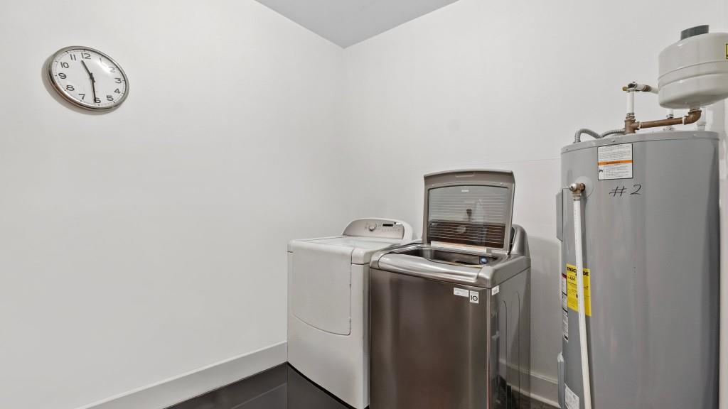 610 Madola Road, Unit 1 Epworth, GA 30541 - Photo 7 of 14 a utility room with dryer and washer