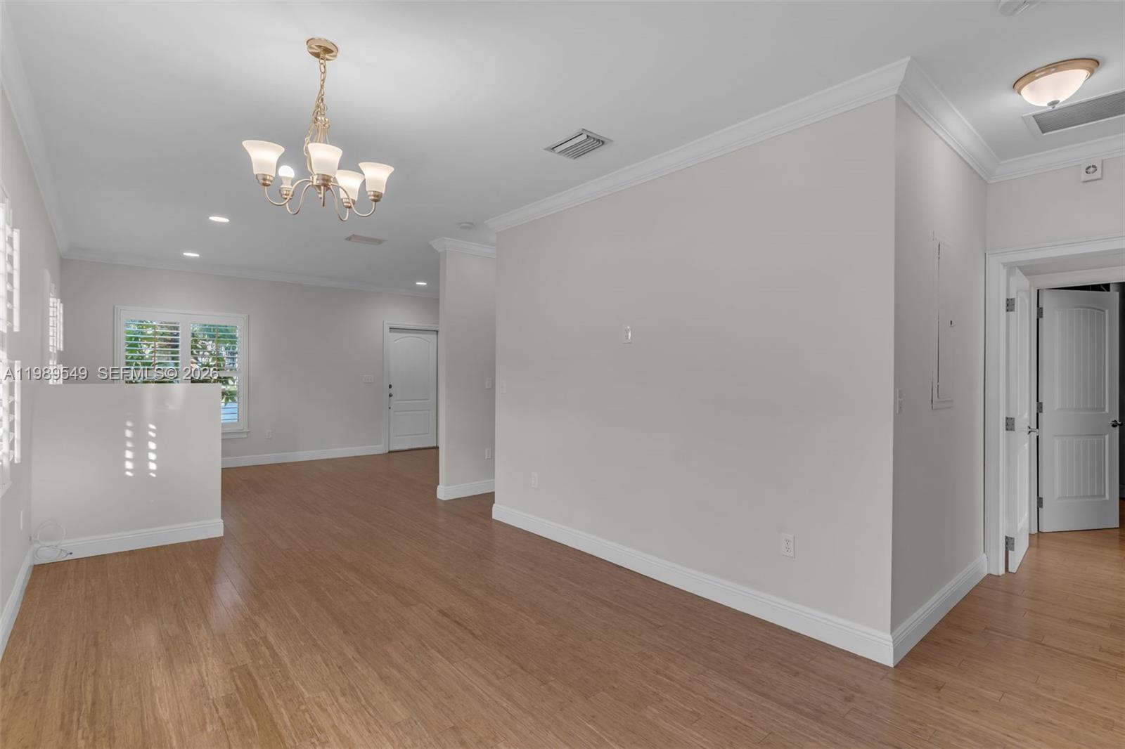 7048 Southwest 83rd Court Miami, FL 33143 - Photo 15 of 38 a view of a big room with wooden floor and kitchen