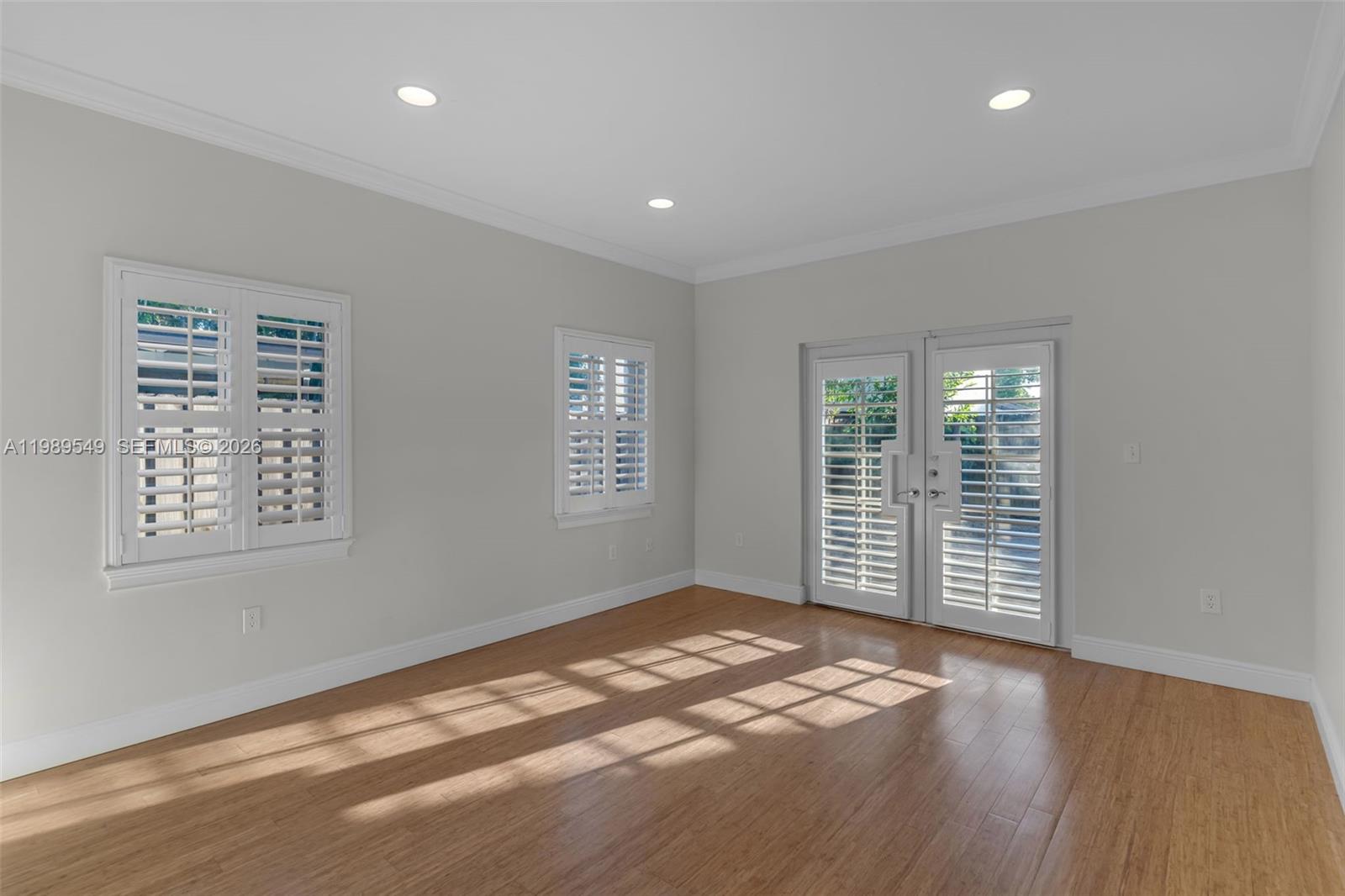 7048 Southwest 83rd Court Miami, FL 33143 - Photo 18 of 38 an empty room with windows