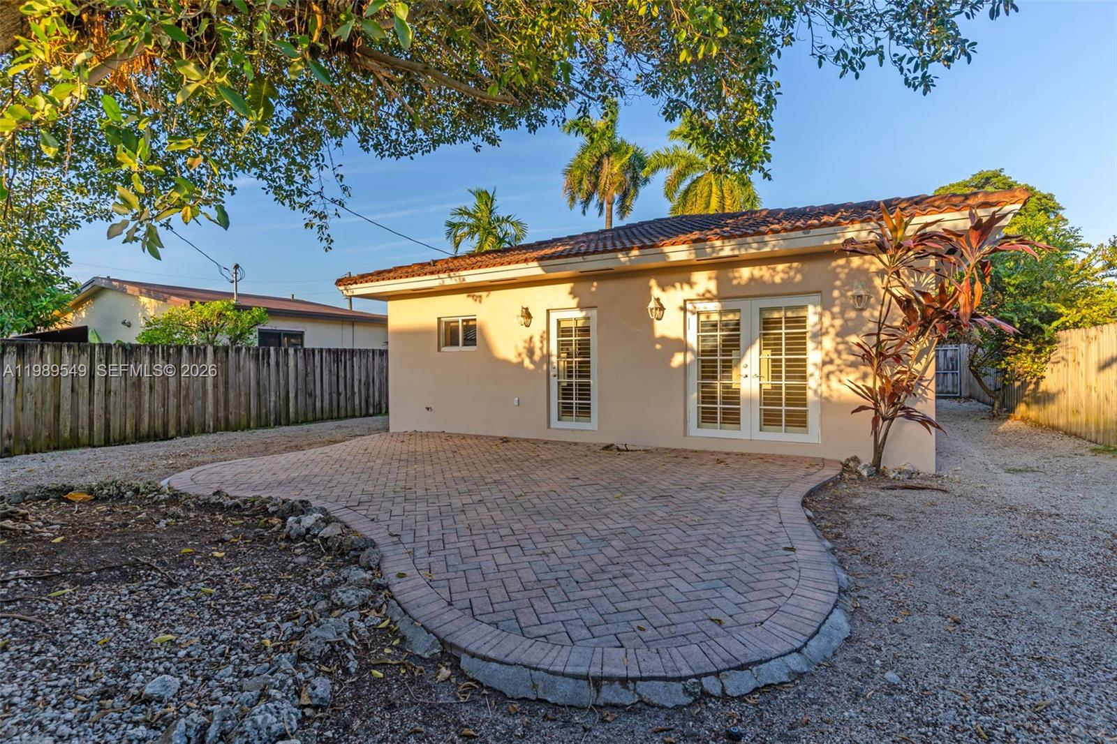 7048 Southwest 83rd Court Miami, FL 33143 - Photo 26 of 38 a view of a house with a backyard