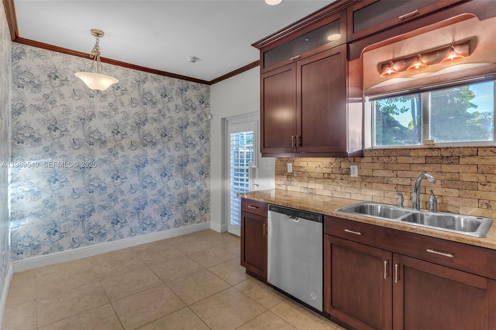 7048 Southwest 83rd Court Miami, FL 33143 - Photo 10 of 38 a bathroom with a granite countertop sink a mirror and a shower