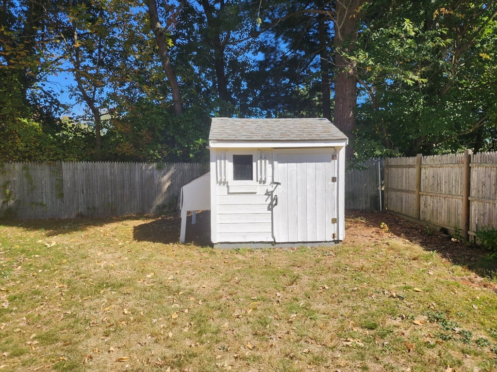 135 Guild Road Brockton, MA 02302 - Photo 11 of 12 a white house that has tree in front of it