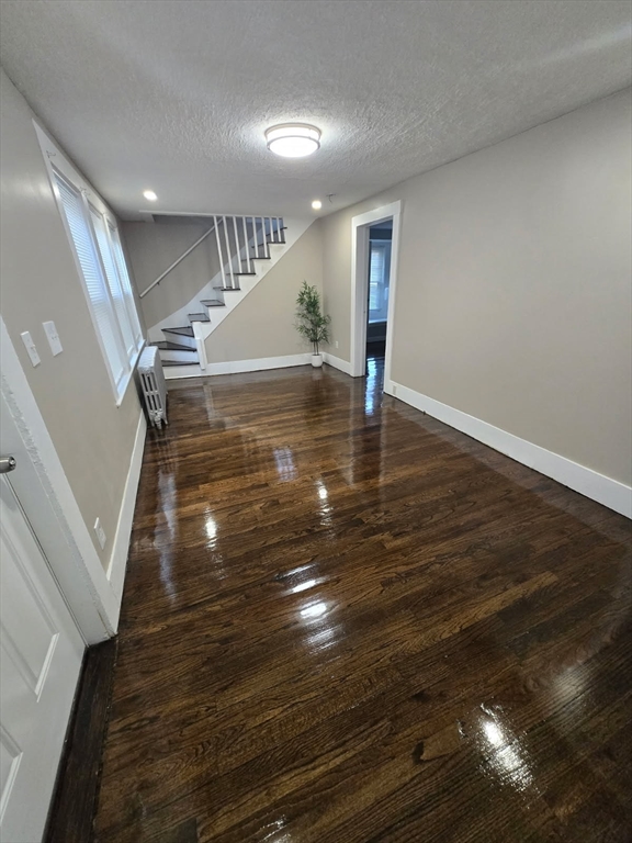 135 Guild Road Brockton, MA 02302 - Photo 3 of 12 a view of entryway and hall with wooden floor