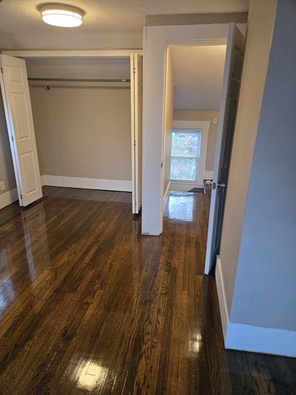 135 Guild Road Brockton, MA 02302 - Photo 7 of 12 a view of a hallway with wooden floor and staircase
