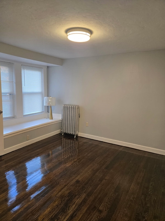 135 Guild Road Brockton, MA 02302 - Photo 8 of 12 a view of a room with wooden floor and a window
