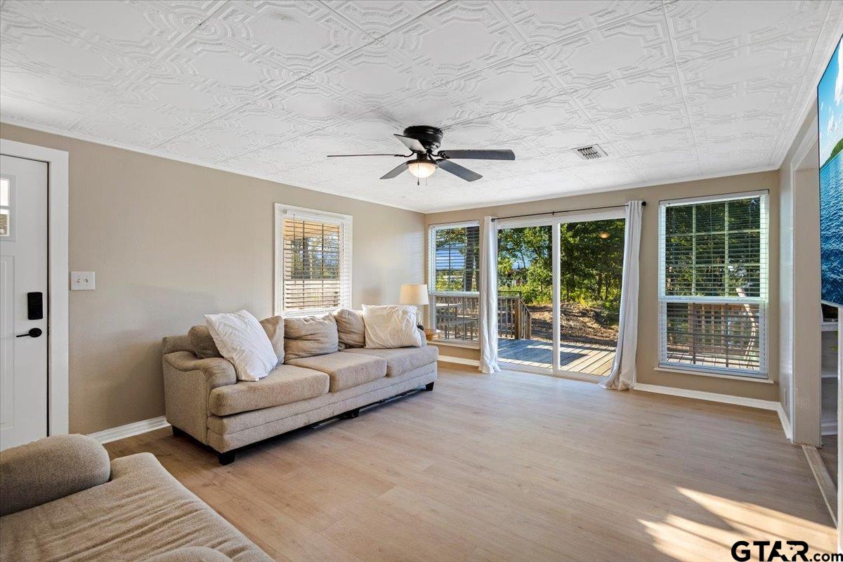 10286 US Highway 69 North Tyler, TX 75706 - Photo 15 of 31 a living room with furniture and a ceiling fan