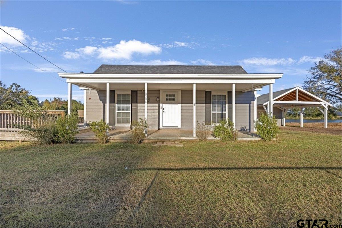 10286 US Highway 69 North Tyler, TX 75706 - Photo 2 of 31 a front view of a house with garden